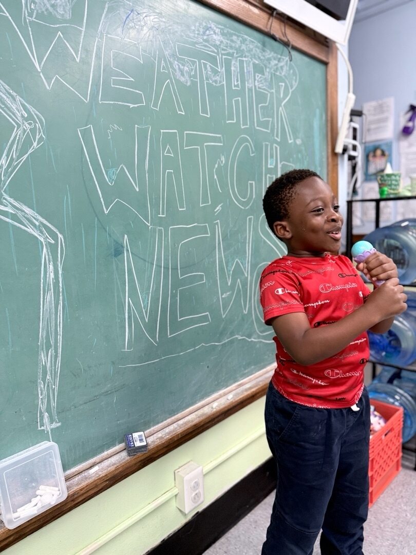 A Brookline Sprouts student presenting the classroom weather update