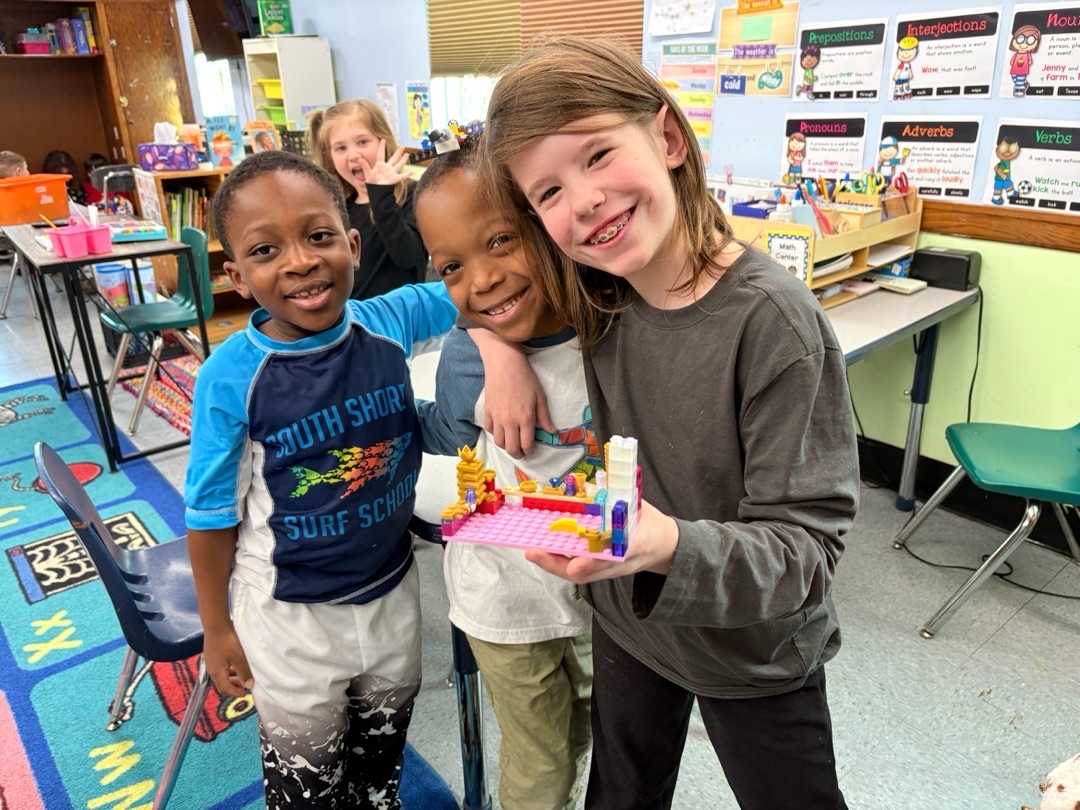 Children showing school age craft work